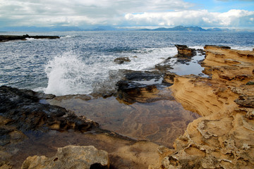 Fototapeta na wymiar Majorca, sandstone coast hit by waves
