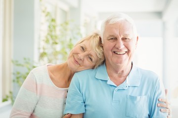 Portrait of happy senior couple smiling