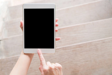 hand using tablet on top view. Clipping path included.