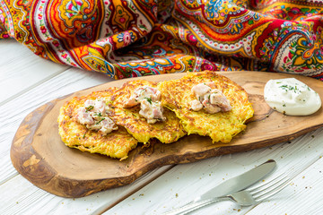 Potato Pancakes with Ham and Dill on Light Wooden Background, Russian Feast Maslenitsa, Horizontal