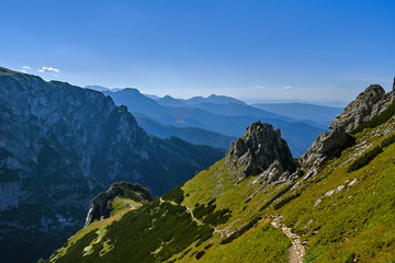 People on the tourist trail on the mountain peaks in the Western Tatras in Poland.