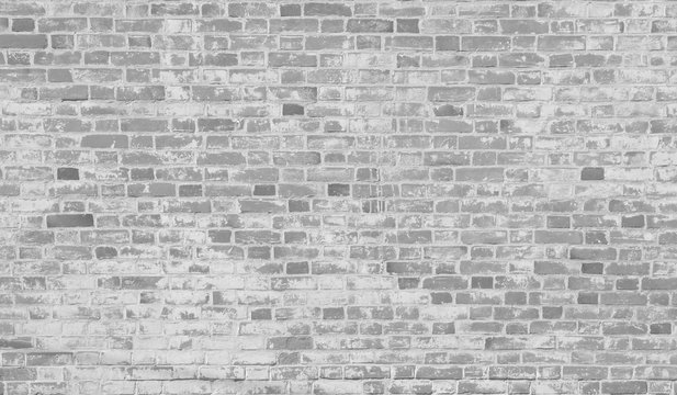 Fototapeta White grey rough old weathered brick wall grunge retro texture background. Home or office design loft style interior
