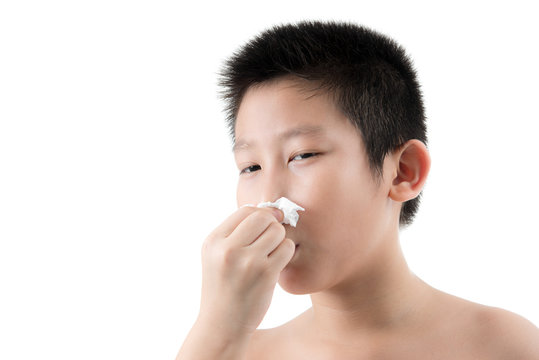 Flu cold or allergy symptom.Sick young asian boy with fever snee