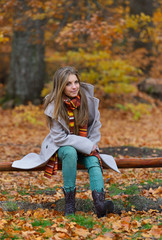 young smiling woman portrait outdoor in autumn