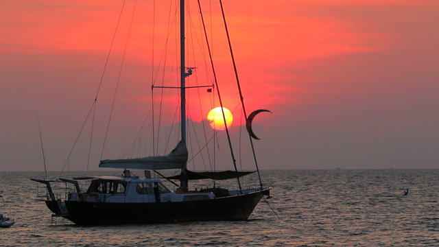 sailing boat and sea activities with sun set sky