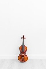 Classical cello on white wall background with copy space.