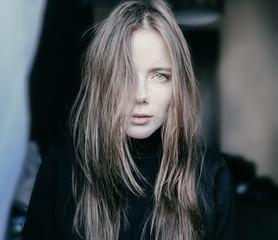 Fototapeta na wymiar Portrait of blonde girl with fluttering hair