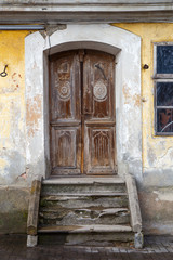 Fototapeta na wymiar Old door with concrete stairs