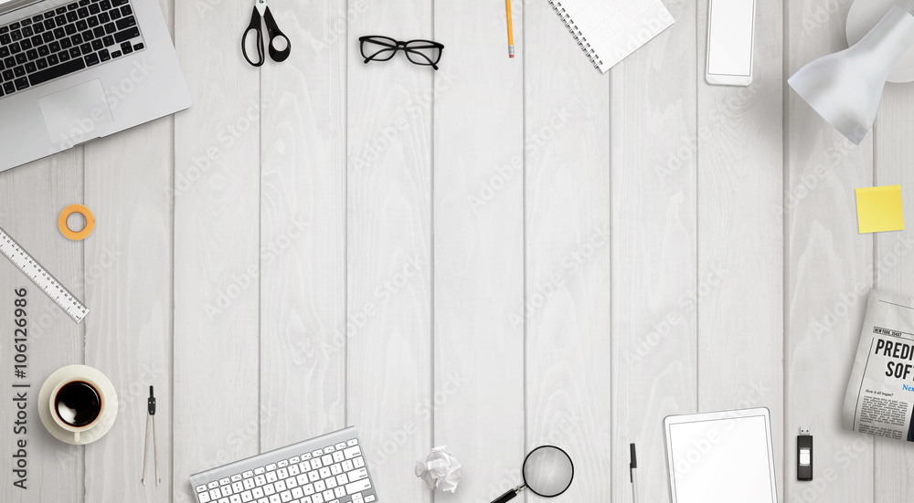 Poster work desk with free space for text surrounded with a lot of desk accessories. there is a laptop, tab