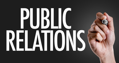 Hand writing the text: Public Relations
