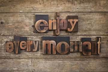 enjoy every moment written with letterpress type