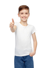 happy boy in white blank t-shirt showing thumbs up