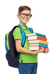 happy student boy with school bag and books