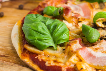 Fresh pizza served on wooden table