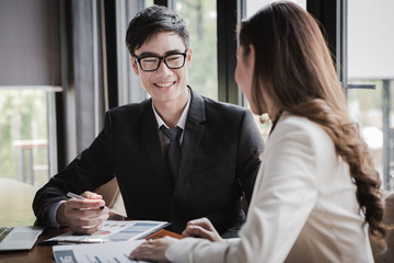 portrait of two business people discussing new project in coffee