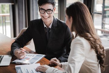portrait of two business people discussing new project in coffee