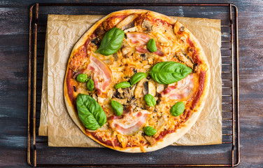 Fresh pizza served on wooden table
