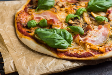 Fresh pizza served on wooden table