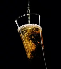 Rollo glass of beer with foam on a black background   © venge