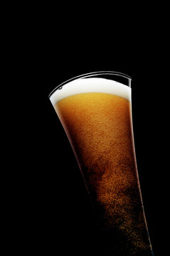 Glass Of Beer On Black Background