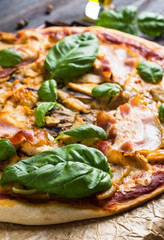Fresh pizza served on wooden table