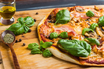 Fresh pizza served on wooden table