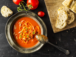 Tomato Soup with Carrots on Table with Bread 