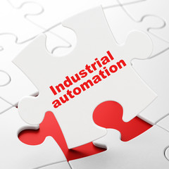 Industry concept: Industrial Automation on puzzle background