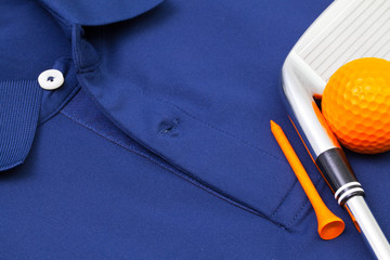 Blue polo shirt and golf equipments