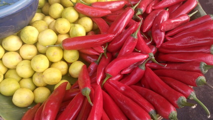 Directly above shot of fresh bell peppers and lemons for sale