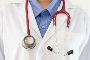 Close up of doctor coat with shirt and stethoscope