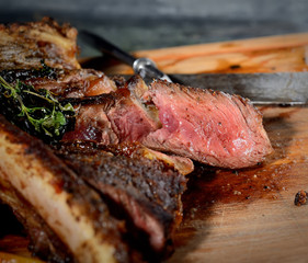 grilled steak on the wooden background