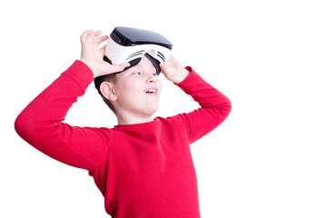Child lifts up virtual reality headset to see