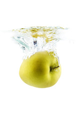 Fototapeta na wymiar Yellow apple falling