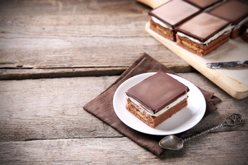 Delicious chocolate brownies on wooden background
