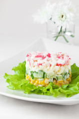 Crab sticks salad on white tablecloth