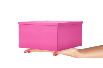 Paper pink gift box on woman hand isolated on white