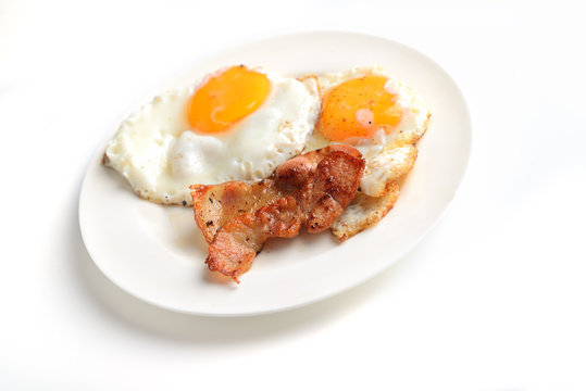 bacon and eggs on a white background
