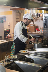 chef's kitchen among the pots in a professional kitchen