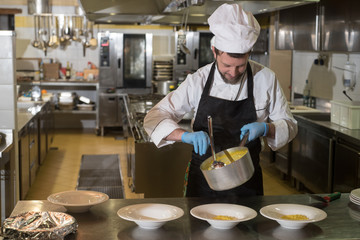 cook prepares the dishes to be brought to the room