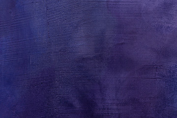 Old scratched and chapped painted violet and purple wall. Abstract textured colored background, empty template