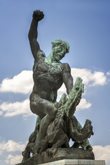 Statue of a Hungarian warrior fighting a three headed dragon on top of Gellert Hill, Budapest, Hungary