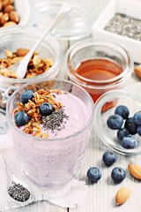 Overnight chia seeds and blueberry yogurt with homemade granola.Healthy eating concept.Selective focus 