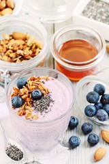 Overnight chia seeds and blueberry yogurt with homemade granola.Healthy eating concept.Selective focus 