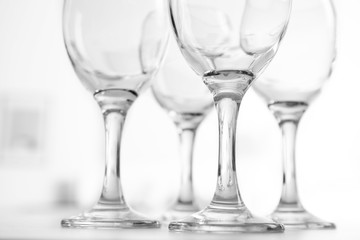 Wineglasses on blurred interior background