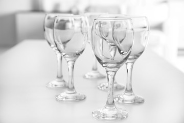 Wineglasses on blurred interior background