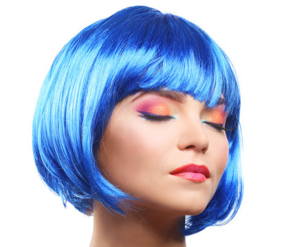 Beautiful girl with colorful makeup and blue wig, isolated on white