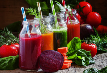 Freshly squeezed vegetable juice in bottles, useful vitamin cock