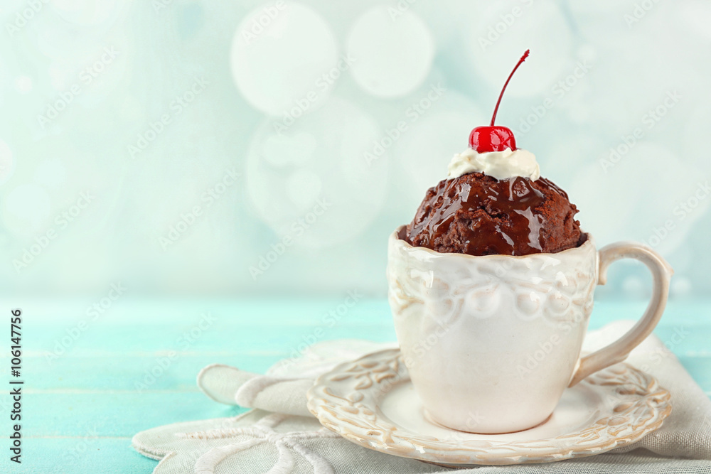 Sticker chocolate mug cake with cream and cherry on a table