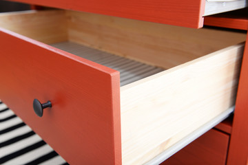 Open shelf of chest of drawers closeup